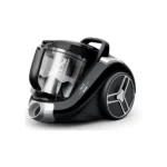 Close-up view of the black Tefal Canister Vacuum Cleaner (TW4B25HA), clearly showing the large, transparent, bagless dust collection cup and filter system.